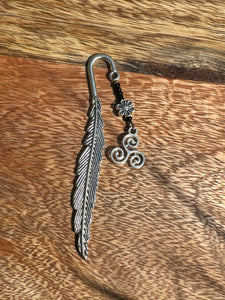 Metal bookmark with triskillion charm