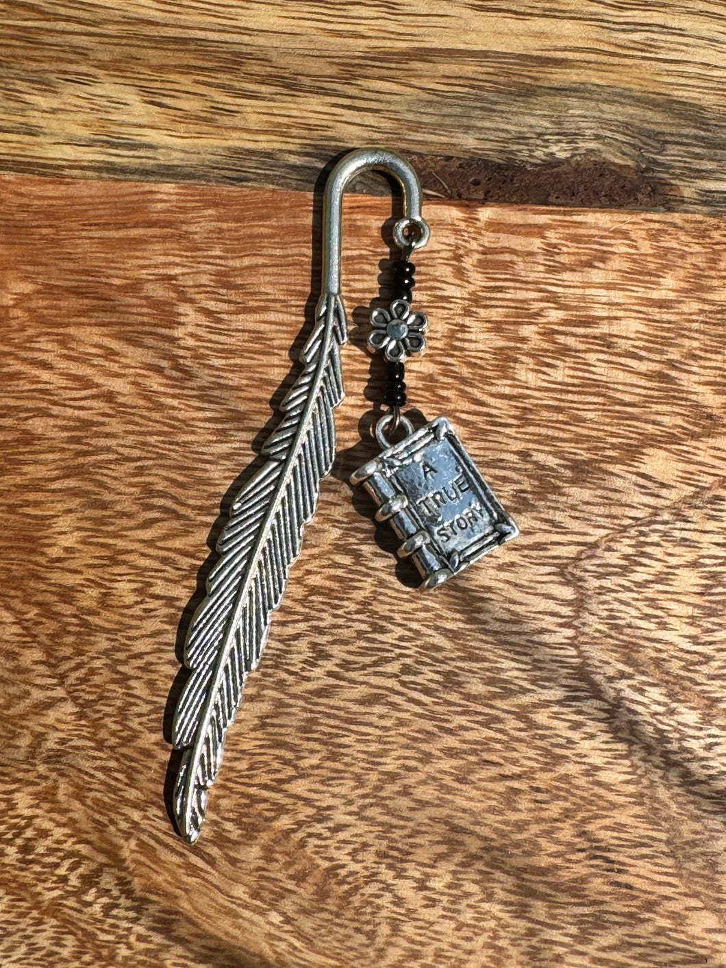 Metal bookmark with book charm